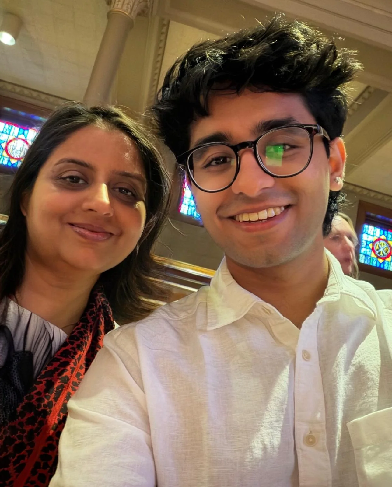 Ayush smiling with his mother in a close selfie