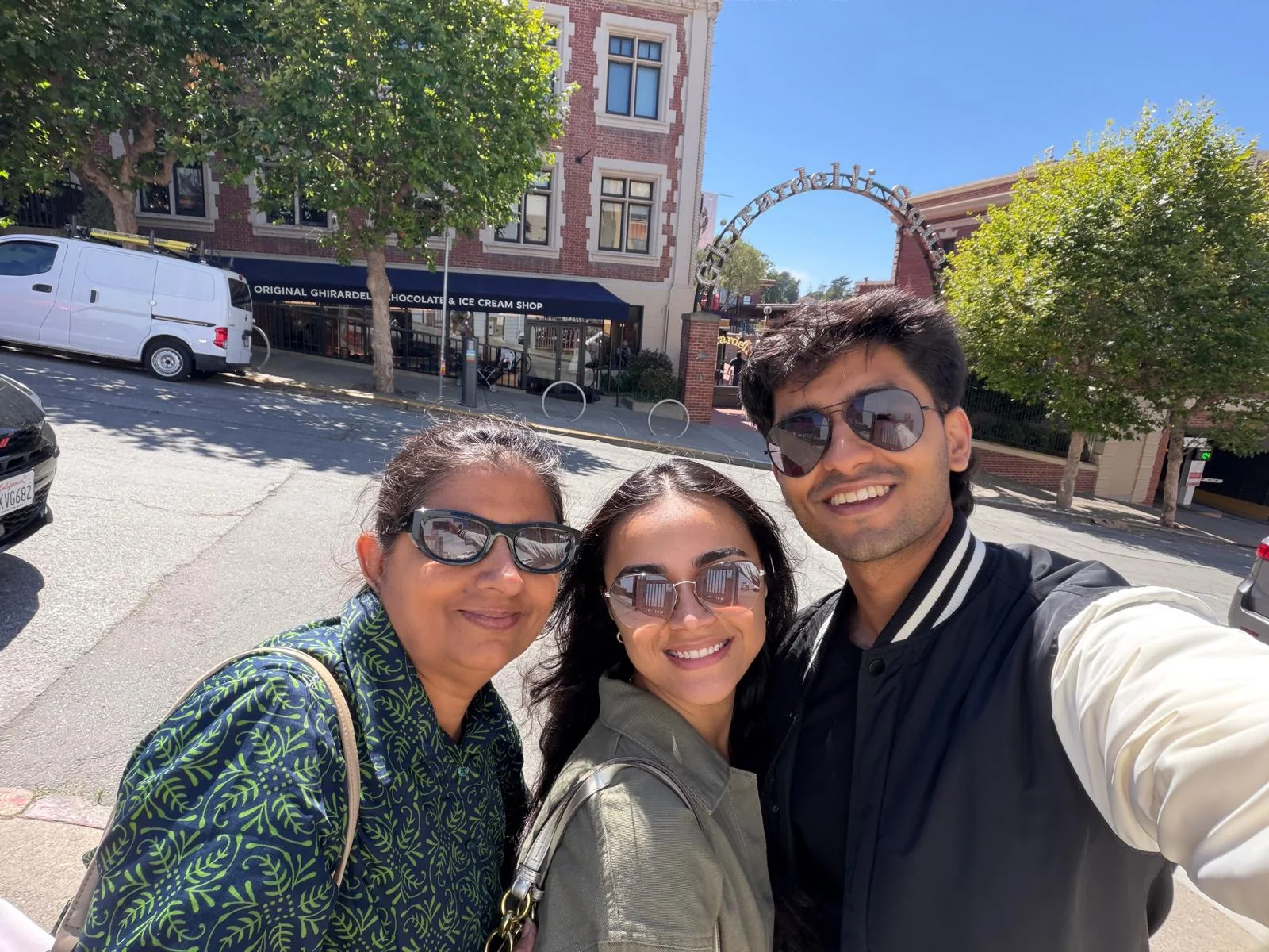 Ayush, his mother, and a loved one outside Ghirardelli Square